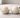 A clean, minimal kitchen countertop scene showing a side-by-side comparison of two scoops of vanilla ice cream in identical small ceramic bowls